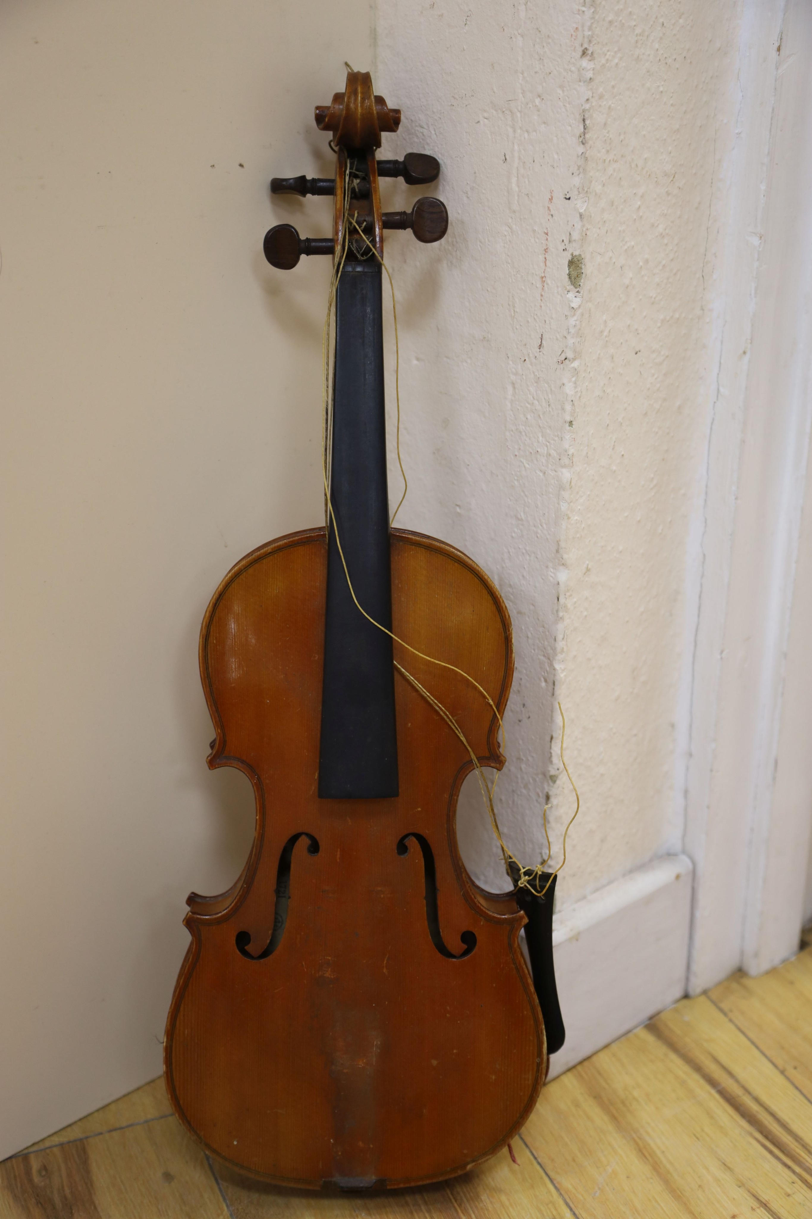 A Stradivarius copy violin and two bows and another bow, both cased, backs 33cm and 30cm